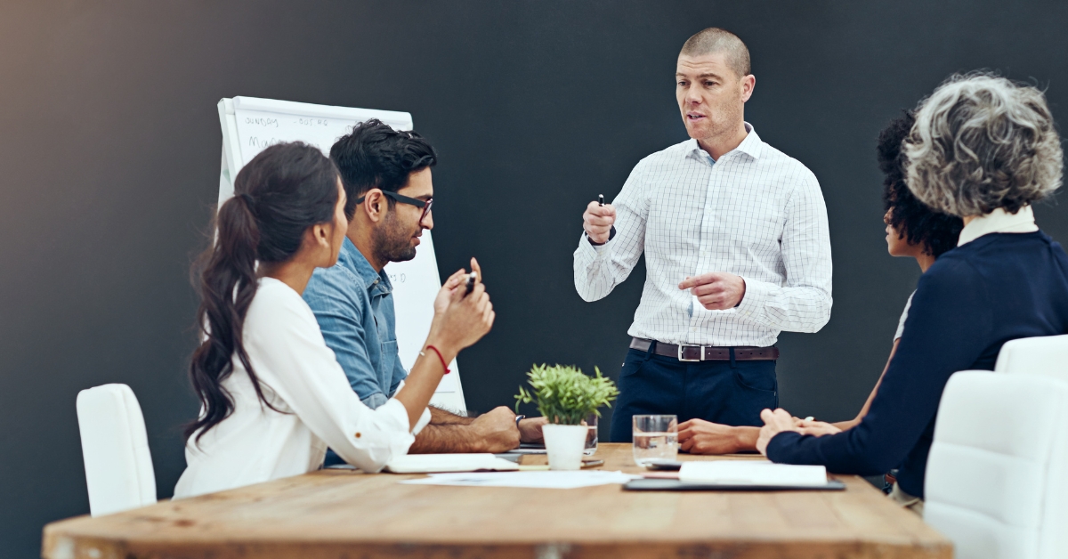 A leader giving presentation to his team about leadership.